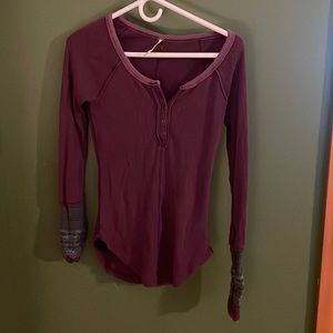 Free people dark plum thermal shirt with gray design on the sleeves